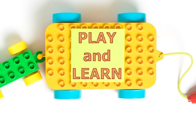 Lego wagon with the words Play and Learn