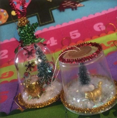 Two handmade Christmas ornaments on a colorful background