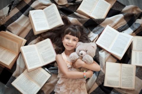 LIttle girl with books