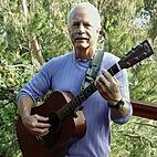 Peter McBride holding a guitar