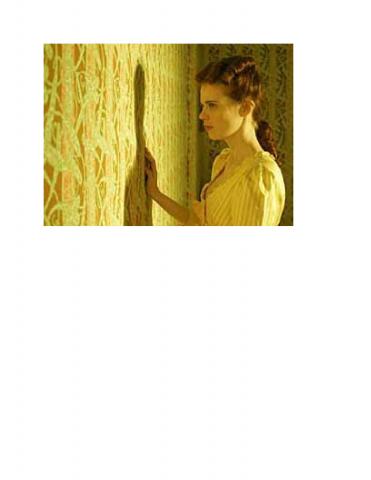 Women touching yellow wallpaper