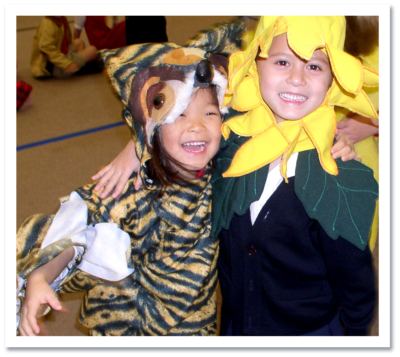 children wearing tiger and sunflower costumes
