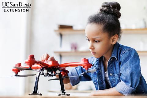 student working on drone