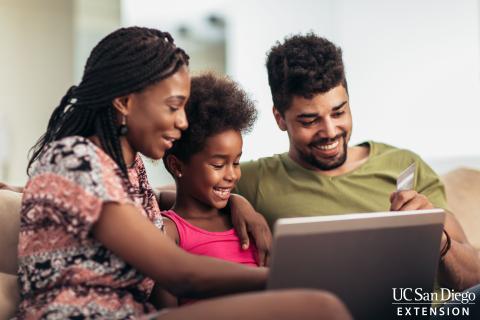 family using laptop computer