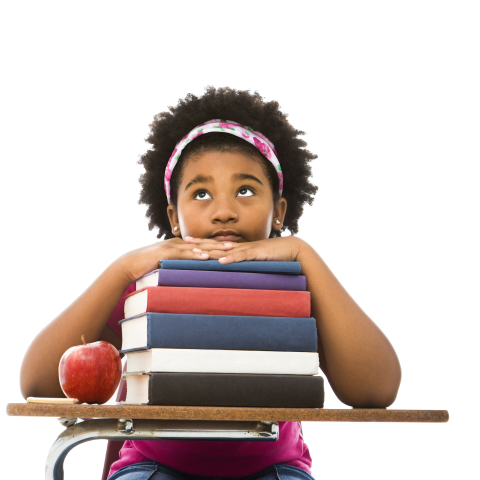 Girl sitting on a desk with an apple and pile of books.