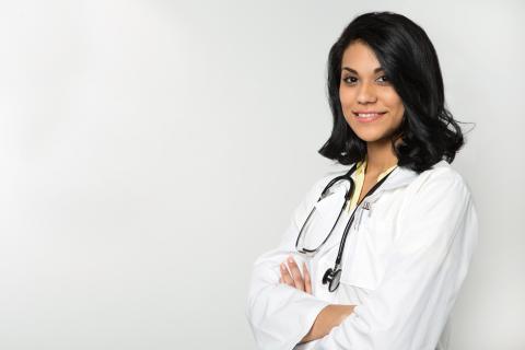 female in lab coat with stethoscope around her neck