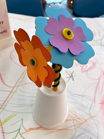 hand crafted paper flowers in cup vase