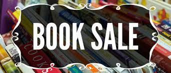 Black placque with BOOK SALE in white letters