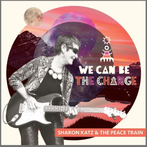 Sharon Katz (a woman holding an electric guitar) with the slogan "We Can be the Change" against a pink, mauve, and orange sunset image