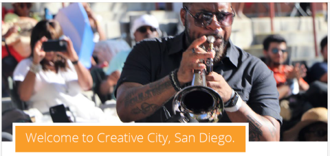 Musician and text "Welcome to Creative City, San Diego"