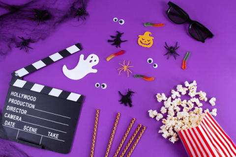 popcorn & ghost against purple background