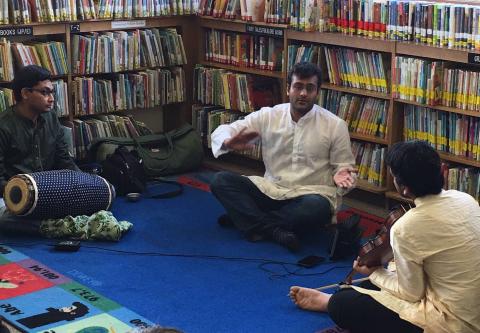 three men performing Indian classical music