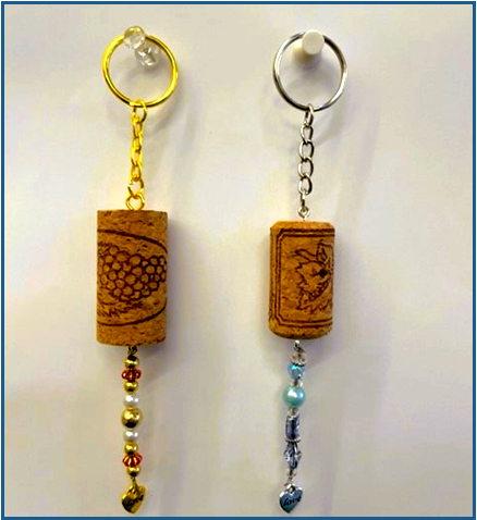 two keychains made from wine corks decorated with beads