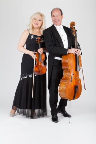 Elaris Duo publicity photo, musicians holding a violin and a cello