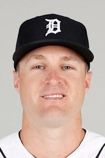 Headshot photo of MLB player Tyler Nevin, wearing a black Detroit Tigers cap with the D logo and a white baseball jersey
