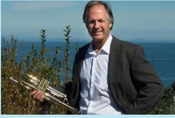 dean ratzman singer holding trombone