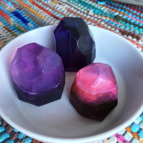 Samples of gemstone soap in purple pink and black