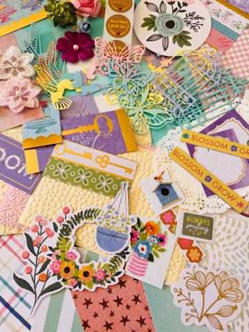 Assorted materials for making summer garden themed greeting cards