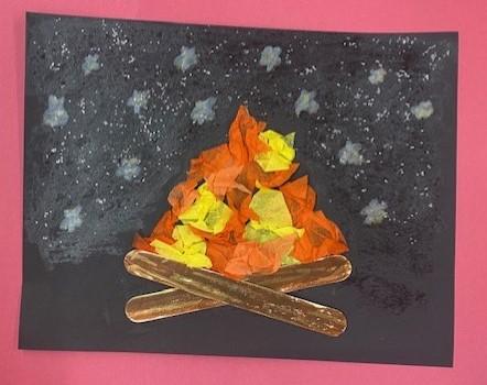 Campfire craft example made with craft sticks and tissue paper on cardstock