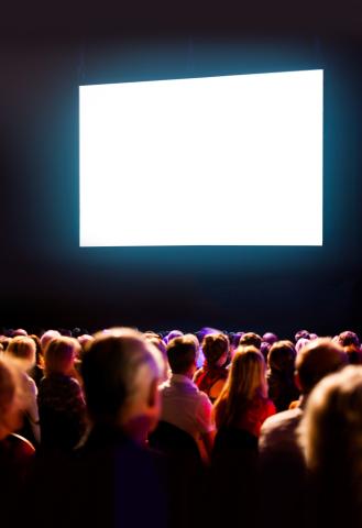 Audience looking at a blank movie screen