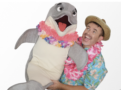 Ventriloquist Marc Griffiths with a large dolphin puppet