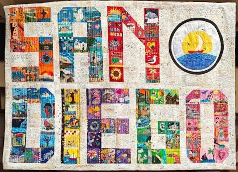 Quilt with colorful blocks that spell out "SAN DIEGO"