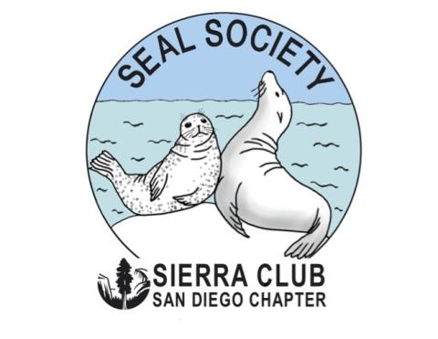 Round logo with 2 sea lions on a rock with the ocean in the background.