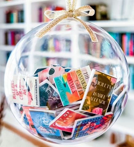 Clear globe ornament full of small books