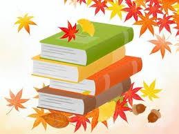 Stack of books with autumn leaves