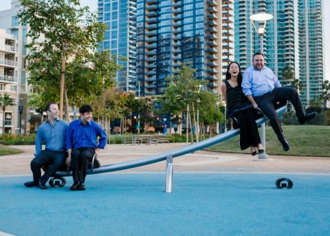 Members of the Hausmann Quartet on a see saw