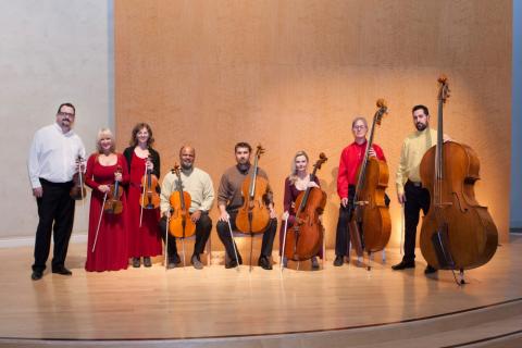 All members of the Hutchins Consort standing and holding instruments