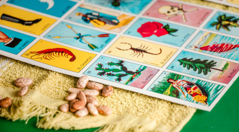 photo of a loteria card next to some dried beans