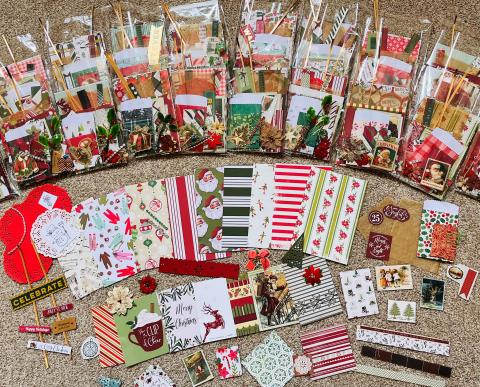 Assorted paper goods, ribbons, stickers, for making winter greeting cards