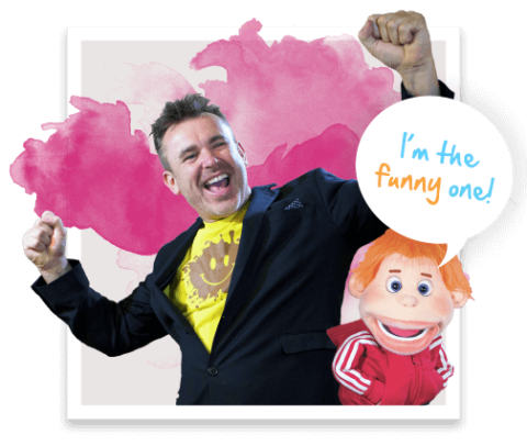 Marc Griffiths, ventriloquists hams with one of his puppets who says - with a word bubble over his head "I'm the funny one"