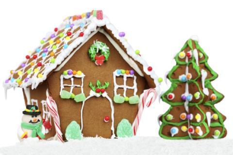 Photo of decorated gingerbread house and tree