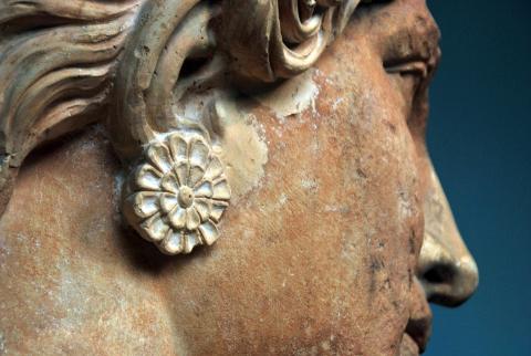 Close-up profile photo of face of statue of Elefsis