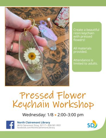 Image shows clear keychain with a pressed chamomile flower 