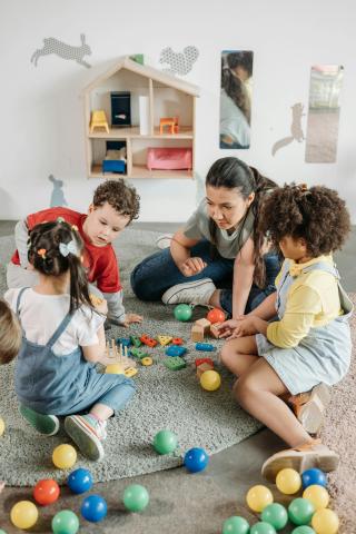 woman playing with children