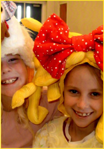 two children dressed in costumes for the play giggle giggle quack moo