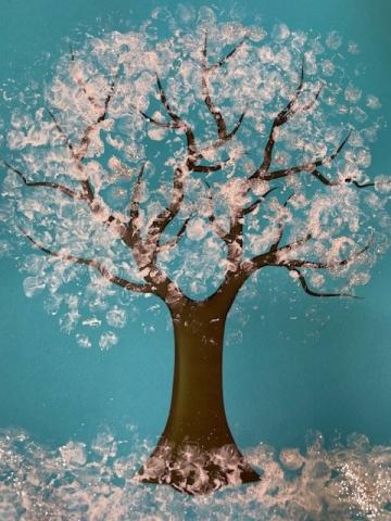 tree painted to look like there is snow on it.