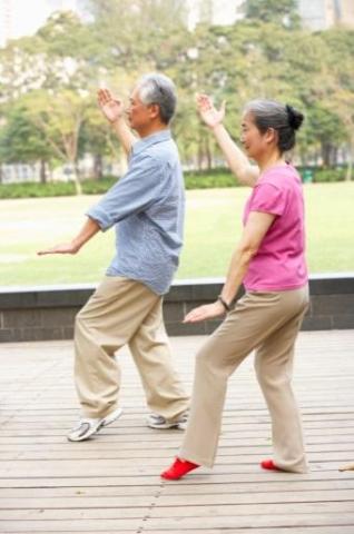 Seniors doing Tai-chi moves