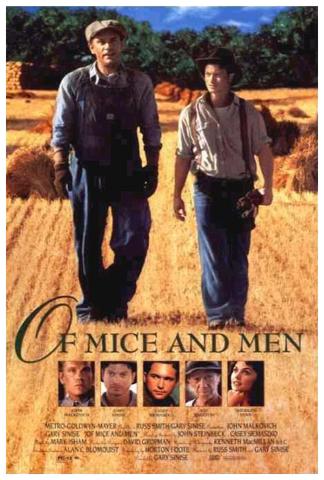 Two men standing in a field.