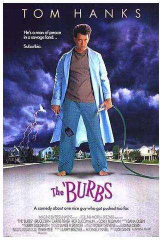 A giant person (Tom Hanks), in a housecoat, holding a spatula in one hand and a garden hose in the other  standing in the middle of the road of a suburban neighborhood with pictures of houses dwarfed in the background.