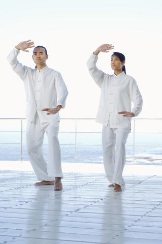 man and woman doing qi gong