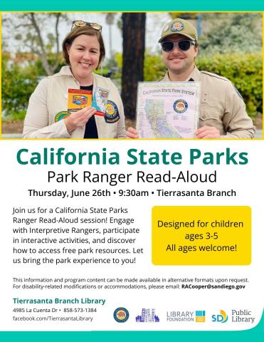 A male and a female park ranger holding books