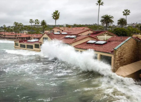 Picture of a giant wave from a king tide crashing into some building in La Jolla Shores February 10, 2020 by photographer Osmund Holm-Hansen.