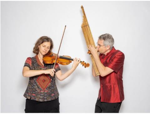 A man and a woman playing musical instruments.