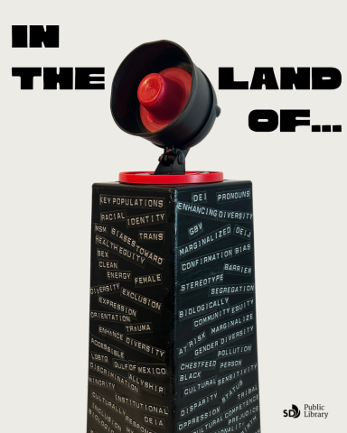 A obelisk with multiple words that have been banned in 2025 with the exhibit title "In the Land of"
