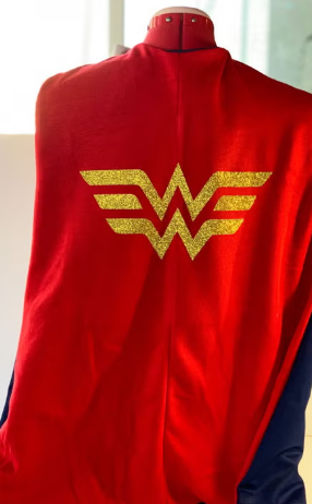 A red superhero cape with a gold emblem.