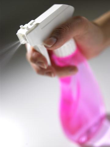Photo of a pink spray bottle with a white top